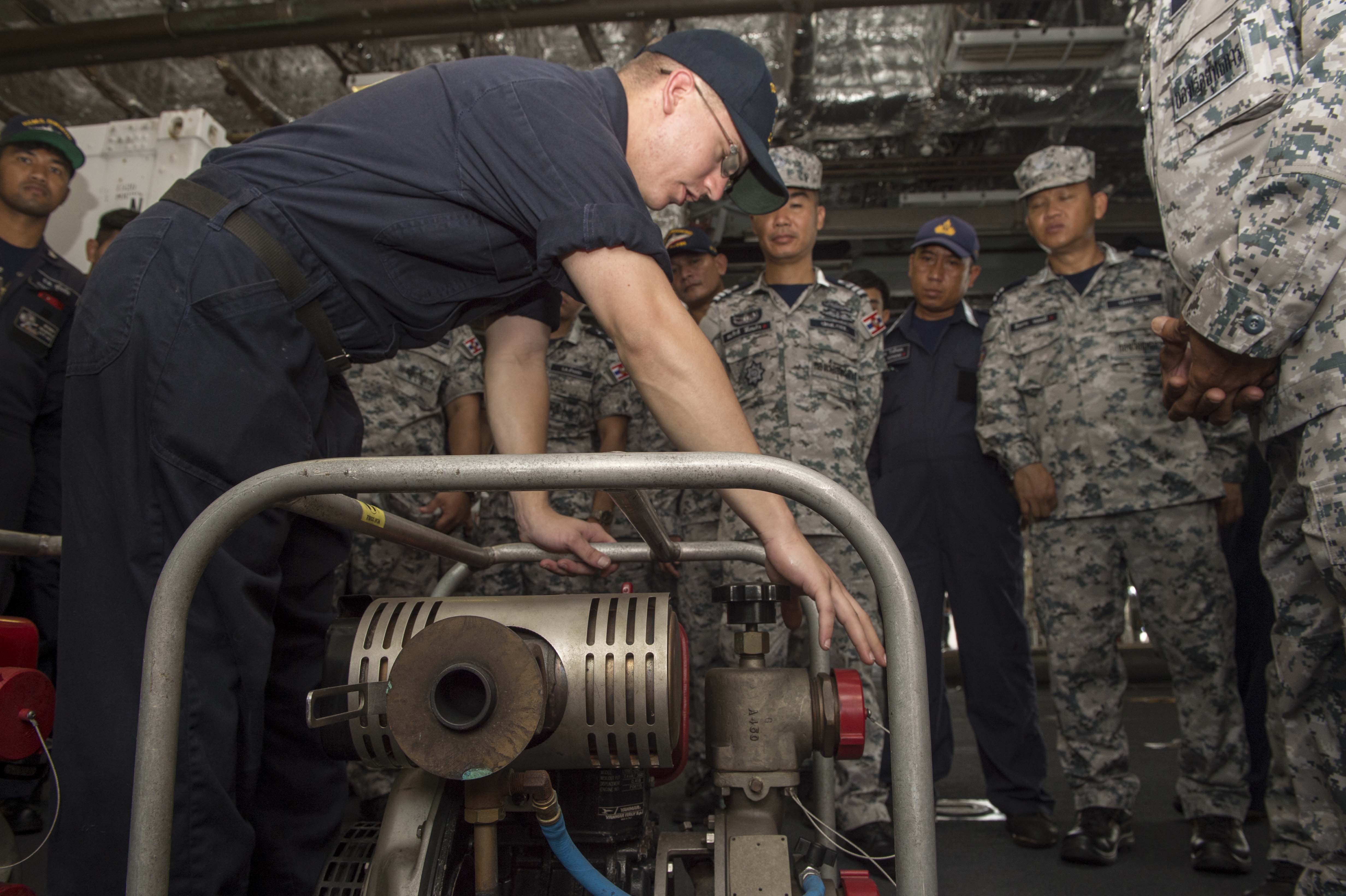 170530-N-PD309-074 SATTAHIP NAVAL BASE, Thailand (May 31, 2017) Hull Technician 1st Class Joshua Lepus conducts damage control training on a P-100 pump for Royal Thai Navy sailors aboard littoral combat ship USS Coronado (LCS 4) during Cooperation Afloat Readiness and Training (CARAT) Thailand. CARAT is a series of Pacific Command-sponsored, U.S Pacific Fleet-led bilateral exercises held annually in South and Southeast Asia to strengthen relationships and enhance force readiness. CARAT exercise events cover a broad range of naval skill areas and disciplines including surface, undersea, air, and amphibious warfare; maritime security operations; riverine, jungle, and explosive ordnance disposal operations; combat construction; diving and salvage; search and rescue; maritime patrol and reconnaissance aviation; maritime domain awareness; military law, public affairs and military medicine; and humanitarian assistance and disaster response. (U.S. Navy photo by Mass Communication Specialist 3rd Class Deven Leigh Ellis/Released)