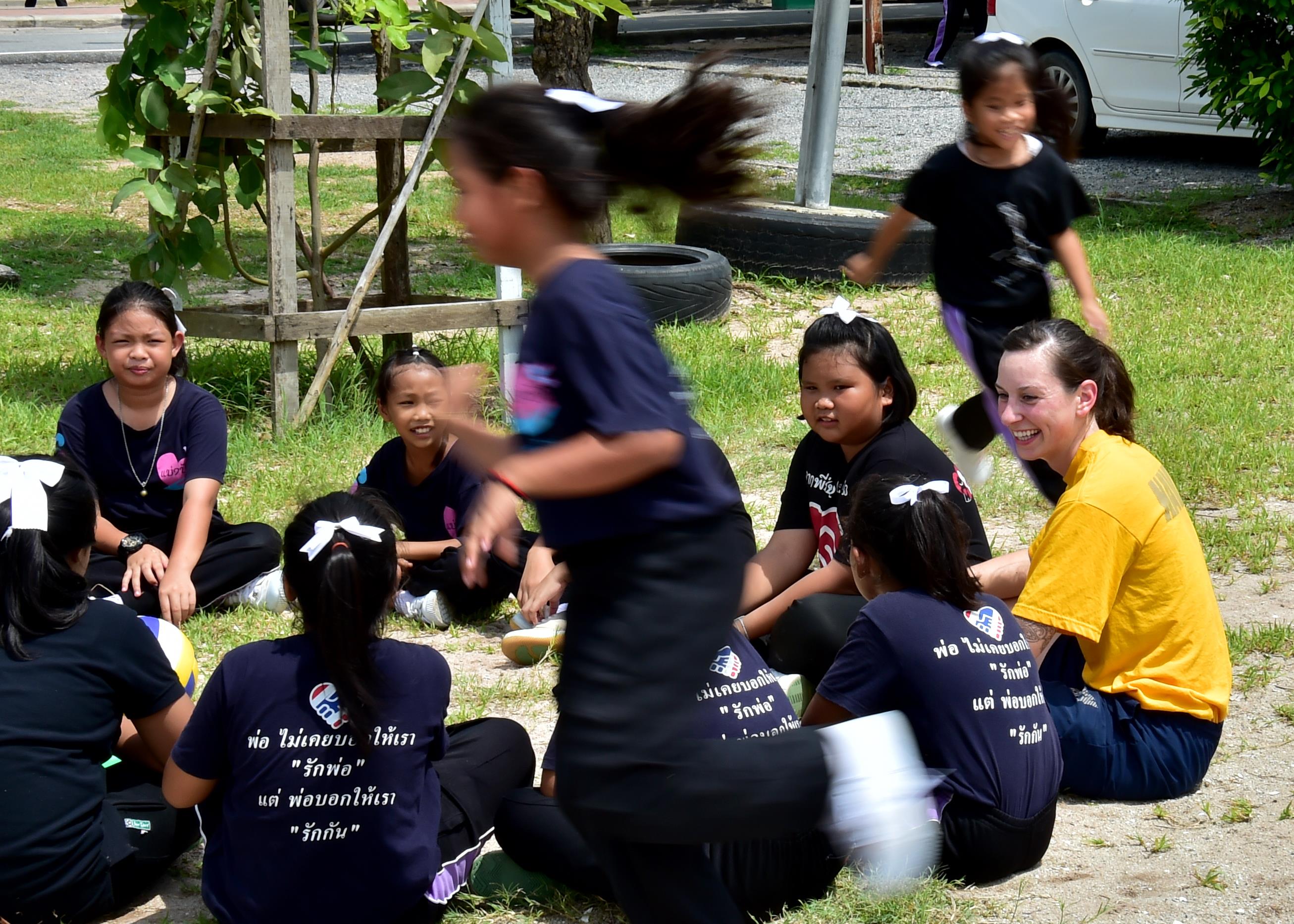170531-N-QV906-376 PATTAYA, Thailand (May 31, 2017) Lt. j.g. Erin Bacon plays duck-duck-goose with children from Banntunggard School during a community outreach event as part of Cooperation Afloat Readiness and Training Thailand 2017 May 31.  Cooperation Afloat Readiness and Training (CARAT) is a series of PACOM sponsored, U.S. Pacific Fleet led bilateral exercises held annually in South and Southeast Asia to strengthen relationships and enhance force readiness. CARAT exercise events cover a broad range of naval skill areas and disciplines including surface, undersea, air and amphibious warfare; maritime security operations; riverine, jungle and explosive ordnance disposal operations; combat construction; diving and salvage; search and rescue; maritime patrol and reconnaissance aviation; maritime domain awareness; military law, public affairs and military medicine; and humanitarian assistance, disaster response. (U.S. Navy photo by Mass Communication Specialist 1st Class Micah Blechner/RELEASED)