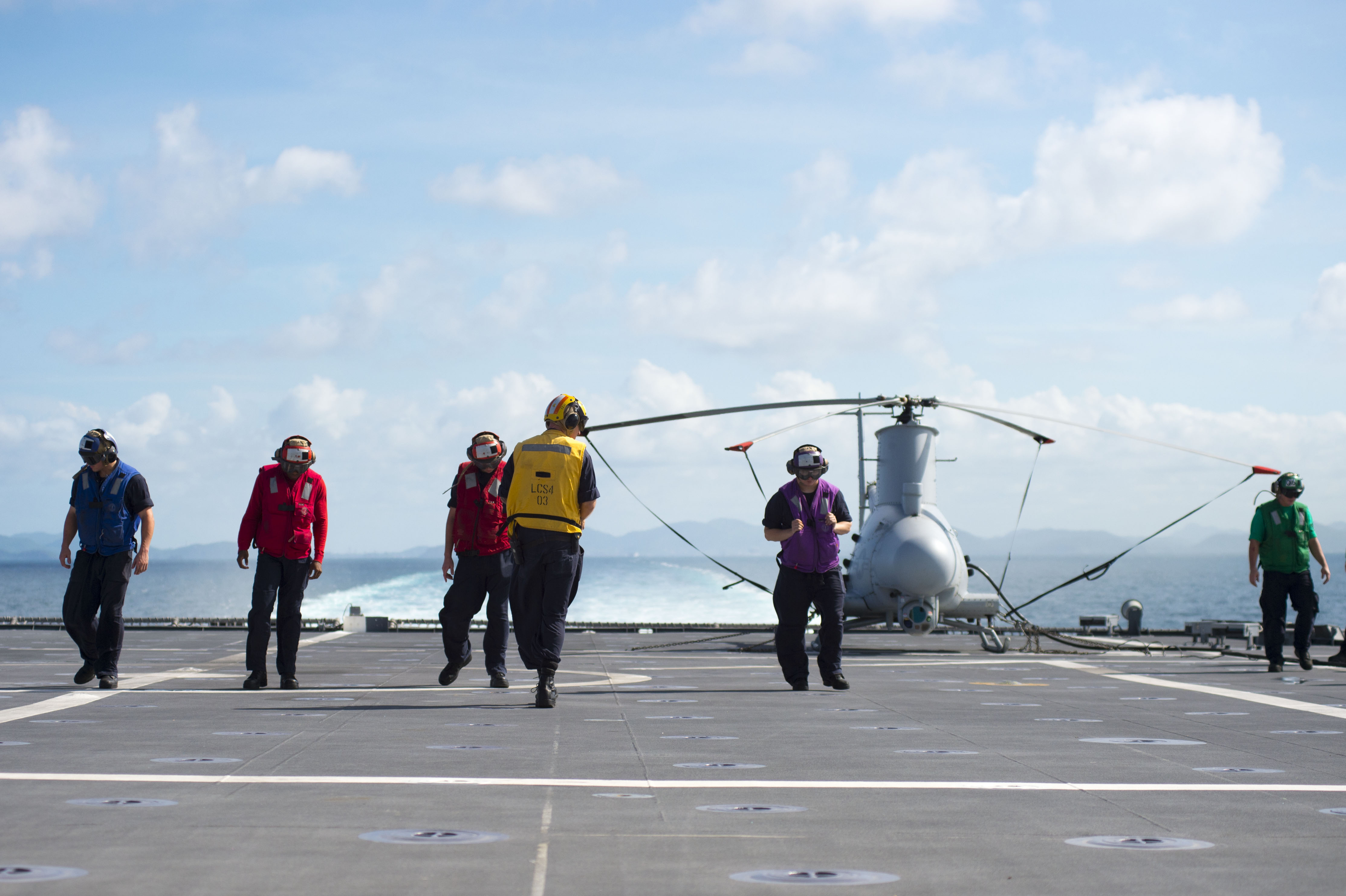 170602-N-PD309-015 GULF OF THAILAND (June 2, 2017) Sailors conduct a foreign-object, debris walkdown before flight quarters aboard littoral combat ship USS Coronado (LCS 4) during Cooperation Afloat Readiness and Training (CARAT) Thailand. CARAT is a series of Pacific Command-sponsored, U.S Pacific Fleet-led bilateral exercises held annually in South and Southeast Asia to strengthen relationships and enhance force readiness. CARAT exercise events cover a broad range of naval skill areas and disciplines including surface, undersea, air, and amphibious warfare; maritime security operations; riverine, jungle, and explosive ordnance disposal operations; combat construction; diving and salvage; search and rescue; maritime patrol and reconnaissance aviation; maritime domain awareness; military law, public affairs and military medicine; and humanitarian assistance and disaster response. (U.S. Navy photo by Mass Communication Specialist 3rd Class Deven Leigh Ellis/Released)