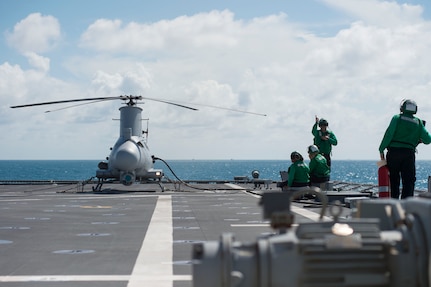 170602-N-PD309-023 GULF OF THAILAND (June 2, 2017) Sailors assigned to the "Wildcards" of Helicopter Sea Combat Squadron 23 prepare the MQ-8B Firescout unmanned aerial vehicle for launch aboard littoral combat ship USS Coronado (LCS 4) during Cooperation Afloat Readiness and Training (CARAT) Thailand. CARAT is a series of Pacific Command-sponsored, U.S Pacific Fleet-led bilateral exercises held annually in South and Southeast Asia to strengthen relationships and enhance force readiness. CARAT exercise events cover a broad range of naval skill areas and disciplines including surface, undersea, air, and amphibious warfare; maritime security operations; riverine, jungle, and explosive ordnance disposal operations; combat construction; diving and salvage; search and rescue; maritime patrol and reconnaissance aviation; maritime domain awareness; military law, public affairs and military medicine; and humanitarian assistance and disaster response. (U.S. Navy photo by Mass Communication Specialist 3rd Class Deven Leigh Ellis/Released)