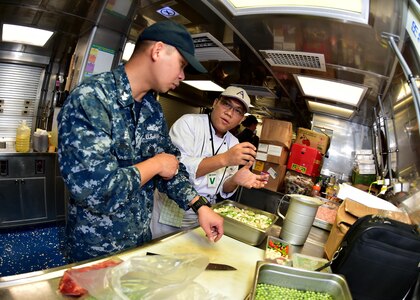 170601-N-QV906-026 SATTAHIP NAVAL BASE, Thailand (June 1, 2017) Culinary Specialist 1st Class Elmer Borja consults with a local chef during a Culinary Subject Matter Expert Exchange aboard USS Coronado (LCS 4) during Cooperation Afloat Readiness and Training Thailand 2017 June 1.  Cooperation Afloat Readiness and Training (CARAT) is a series of PACOM sponsored, U.S. Pacific Fleet led bilateral exercises held annually in South and Southeast Asia to strengthen relationships and enhance force readiness. CARAT exercise events cover a broad range of naval skill areas and disciplines including surface, undersea, air and amphibious warfare; maritime security operations; riverine, jungle and explosive ordnance disposal operations; combat construction; diving and salvage; search and rescue; maritime patrol and reconnaissance aviation; maritime domain awareness; military law, public affairs and military medicine; and humanitarian assistance, disaster response. (U.S. Navy photo by Mass Communication Specialist 1st Class Micah Blechner/RELEASED)
