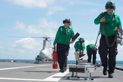 170602-N-PD309-046 GULF OF THAILAND (June 2, 2017) Sailors assigned to the "Wildcards" of Helicopter Sea Combat Squadron 23 depart the flight deck after preparing the MQ-8B Firescout unmanned aerial vehicle for launch aboard littoral combat ship USS Coronado (LCS 4) during Cooperation Afloat Readiness and Training (CARAT) Thailand. CARAT is a series of Pacific Command-sponsored, U.S Pacific Fleet-led bilateral exercises held annually in South and Southeast Asia to strengthen relationships and enhance force readiness. CARAT exercise events cover a broad range of naval skill areas and disciplines including surface, undersea, air, and amphibious warfare; maritime security operations; riverine, jungle, and explosive ordnance disposal operations; combat construction; diving and salvage; search and rescue; maritime patrol and reconnaissance aviation; maritime domain awareness; military law, public affairs and military medicine; and humanitarian assistance and disaster response. (U.S. Navy photo by Mass Communication Specialist 3rd Class Deven Leigh Ellis/Released)