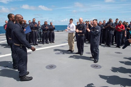 170602-N-PD309-074 GULF OF THAILAND (June 2, 2017) The crew of littoral combat ship USS Coronado (LCS 4) congratulate its newest frocked senior chief petty officers during transit as part of Cooperation Afloat Readiness and Training (CARAT) Thailand. CARAT is a series of Pacific Command-sponsored, U.S Pacific Fleet-led bilateral exercises held annually in South and Southeast Asia to strengthen relationships and enhance force readiness. CARAT exercise events cover a broad range of naval skill areas and disciplines including surface, undersea, air, and amphibious warfare; maritime security operations; riverine, jungle, and explosive ordnance disposal operations; combat construction; diving and salvage; search and rescue; maritime patrol and reconnaissance aviation; maritime domain awareness; military law, public affairs and military medicine; and humanitarian assistance and disaster response. (U.S. Navy photo by Mass Communication Specialist 3rd Class Deven Leigh Ellis/Released)