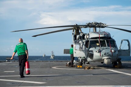 170603-N-PD309-128 GULF OF THAILAND (June 3, 2017) Sailors assigned to the "Wildcards" of Helicopter Sea Combat Squadron 23 aboard littoral combat ship USS Coronado (LCS 4) ready the MH-60S Seahawk helicopter for launch before a division tactics exercise with the Royal Thai Navy during Cooperation Afloat Readiness and Training (CARAT) Thailand. CARAT is a series of Pacific Command-sponsored, U.S Pacific Fleet-led bilateral exercises held annually in South and Southeast Asia to strengthen relationships and enhance force readiness. CARAT exercise events cover a broad range of naval skill areas and disciplines including surface, undersea, air, and amphibious warfare; maritime security operations; riverine, jungle, and explosive ordnance disposal operations; combat construction; diving and salvage; search and rescue; maritime patrol and reconnaissance aviation; maritime domain awareness; military law, public affairs and military medicine; and humanitarian assistance and disaster response. (U.S. Navy photo by Mass Communication Specialist 3rd Class Deven Leigh Ellis/Released)