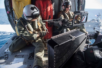 170603-N-PD309-171 GULF OF THAILAND, Thailand (June 3, 2017) Naval Aircrewman (Helicopter) 1st Class Sean Erickson, left, and Naval Aircrewman (Helicopter) 2nd Class Jeffery Marr, assigned to the "Wildcards" of Helicopter Sea Combat Squadron 23 aboard littoral combat ship USS Coronado (LCS 4), prepare for gunnery and division tactics exercises onboard the embarked MH-60S Seahawk helicopter during Cooperation Afloat Readiness and Training (CARAT) Thailand. CARAT is a series of Pacific Command-sponsored, U.S Pacific Fleet-led bilateral exercises held annually in South and Southeast Asia to strengthen relationships and enhance force readiness. CARAT exercise events cover a broad range of naval skill areas and disciplines including surface, undersea, air, and amphibious warfare; maritime security operations; riverine, jungle, and explosive ordnance disposal operations; combat construction; diving and salvage; search and rescue; maritime patrol and reconnaissance aviation; maritime domain awareness; military law, public affairs and military medicine; and humanitarian assistance and disaster response. (U.S. Navy photo by Mass Communication Specialist 3rd Class Deven Leigh Ellis/Released)