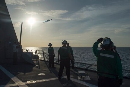 170604-N-PD309-051 GULF OF THAILAND (June 4, 2017) Sailors aboard littoral combat ship USS Coronado (LCS 4) watch a P-3 Orion fly overhead anti-submarine warfare training during Cooperation Afloat Readiness and Training (CARAT) Thailand. CARAT is a series of Pacific Command-sponsored, U.S Pacific Fleet-led bilateral exercises held annually in South and Southeast Asia to strengthen relationships and enhance force readiness. CARAT exercise events cover a broad range of naval skill areas and disciplines including surface, undersea, air, and amphibious warfare; maritime security operations; riverine, jungle, and explosive ordnance disposal operations; combat construction; diving and salvage; search and rescue; maritime patrol and reconnaissance aviation; maritime domain awareness; military law, public affairs and military medicine; and humanitarian assistance and disaster response. (U.S. Navy photo by Mass Communication Specialist 3rd Class Deven Leigh Ellis/Released)