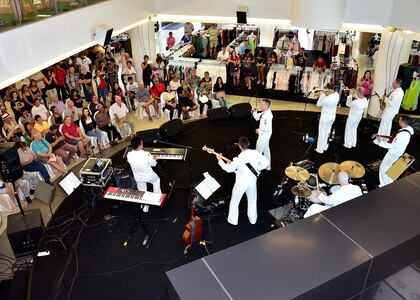 170604-N-QV906-088 PATTAYA, Thailand (June 4, 2017) The U.S. 7th Fleet Band, Orient Express, jams out during a performance at Golden Plaza Mall in Pattaya, Thailand, while participating in Cooperation Afloat Readiness and Training Thailand 2017 June 3.  Cooperation Afloat Readiness and Training (CARAT) is a series of PACOM sponsored, U.S. Pacific Fleet led bilateral exercises held annually in South and Southeast Asia to strengthen relationships and enhance force readiness. CARAT exercise events cover a broad range of naval skill areas and disciplines including surface, undersea, air and amphibious warfare; maritime security operations; riverine, jungle and explosive ordnance disposal operations; combat construction; diving and salvage; search and rescue; maritime patrol and reconnaissance aviation; maritime domain awareness; military law, public affairs and military medicine; and humanitarian assistance, disaster response. (U.S. Navy photo by Mass Communication Specialist 1st Class Micah Blechner/RELEASED)