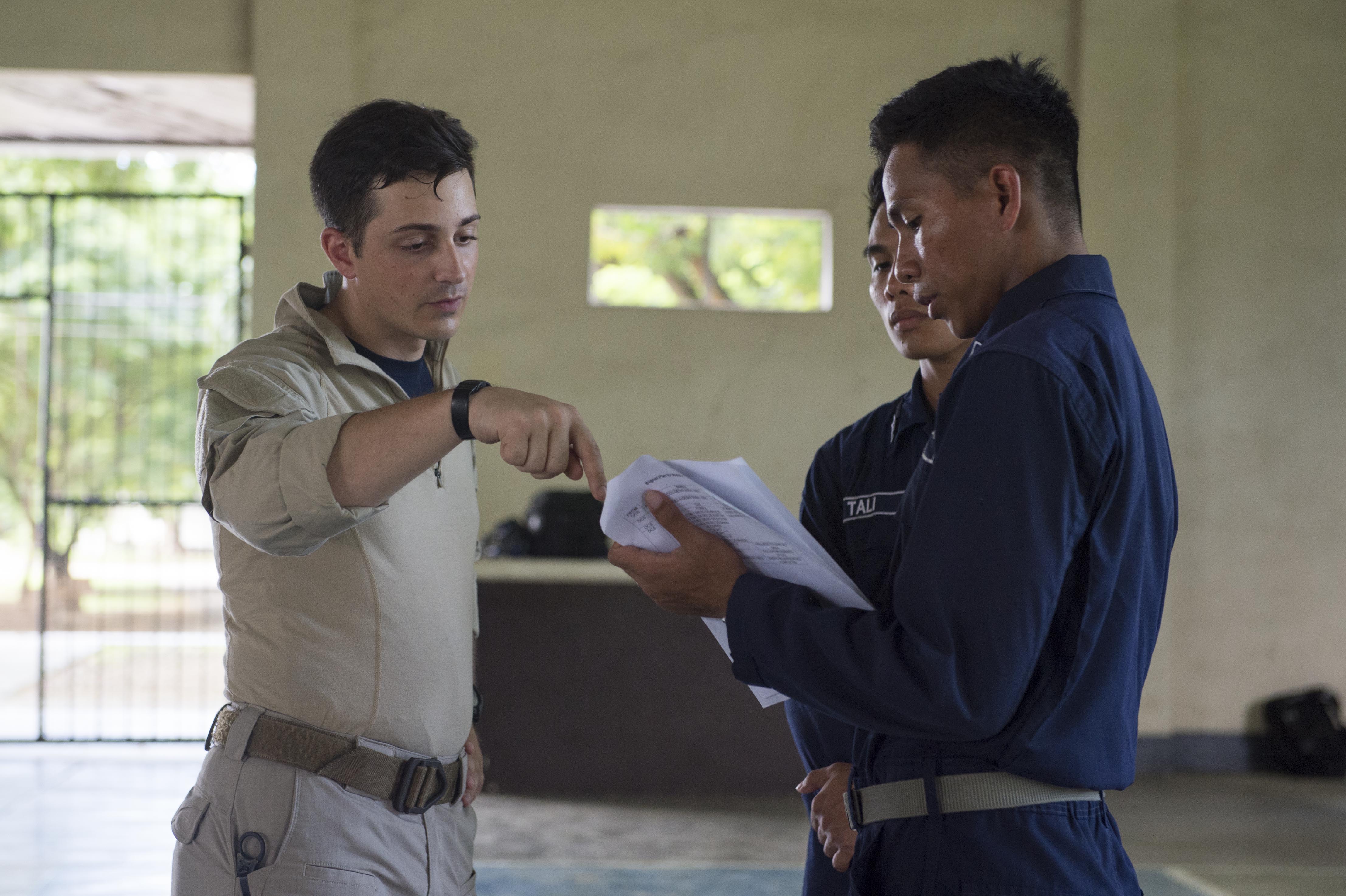 170619-N-PD309-118 CEBU, Philippines (June 19, 2017) Lt. Jonathan Godbolt, assigned to littoral combat ship USS Coronado (LCS 4) visit, board, search and seizure (VBSS) team, collaborates with members of the Philippine Navy on VBSS tactics and techniques as part of Maritime Training Activity Sama Sama. Coronado is on a rotational deployment in U.S. 7th Fleet area of responsibility, patrolling the region's littorals and working hull-to-hull with partner navies to provide 7th Fleet with the flexible capabilities it needs now and in the future. (U.S. Navy photo by Mass Communication Specialist 3rd Class Deven Leigh Ellis/Released)
