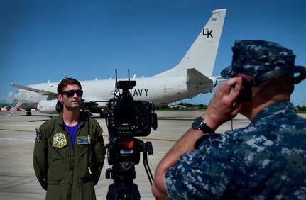 170619-N-QV906-145 MACTAN AIRBASE, Philippines (June 19, 2017) Lt. Carson Burton, Mission Commander of Combat Air Crew 4 attached to Patrol Squadron 26 (VP-26),  answers questions from Mass Communication Specialist 2nd Class Taylor Mohr, of Armed Forces Network, while participating in Maritime Training Activity (MTA) Sama Sama 2017 in Cebu, Philippines, June 19.  MTA Sama Sama is a bilateral maritime exercise between U.S. and Philippine naval forces and is designed to strengthen cooperation and interoperabillty between the nations' armed forces.  (U.S. Navy photo by Mass Communication Specialist 1st Class Micah Blechner/RELEASED)