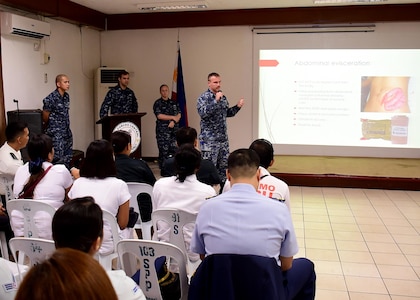 170620-N-QV906-010 CEBU, Philippines (June 20, 2017) Hospital Corpsman 1st Class Richard Spees (center) of USS CORONADO (LCS 4) discusses types of injuries during an Interactive Medical Engagement for Maritime Training Activity (MTA) Sama Sama 2017 CEBU, Philippines, June 20.  MTA Sama Sama is a bilateral maritime exercise between U.S. and Philippine naval forces and is designed to strengthen cooperation and interoperability between the nations' armed forces.  (U.S. Navy photo by Mass Communication Specialist 1st Class Micah Blechner/RELEASED)