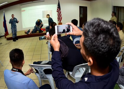 170620-N-QV906-036 CEBU, Philippines (June 20, 2017) Sailors attached to USS CORONADO (LCS 4) demonstrate life-saving skills during an Interactive Medical Engagement for Maritime Training Activity (MTA) Sama Sama 2017 CEBU, Philippines, June 20.  MTA Sama Sama is a bilateral maritime exercise between U.S. and Philippine naval forces and is designed to strengthen cooperation and interoperability between the nations' armed forces.  (U.S. Navy photo by Mass Communication Specialist 1st Class Micah Blechner/RELEASED)