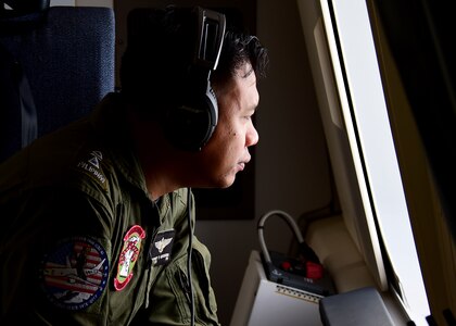 170622-N-QV906-109 CEBU, Philippines (June 22, 2017) A member of the Armed Forces of the Philippines takes watch out an observation window of a P-8 Poseidon aircraft during a demonstration flight for Maritime Training Activity (MTA) Sama Sama 2017 in Cebu, Philippines, June 22.  MTA Sama Sama is a bilateral maritime exercise between U.S. and Philippine naval forces and is designed to strengthen cooperation and interoperability between the nations' armed forces.  (U.S. Navy photo by Mass Communication Specialist 1st Class Micah Blechner/RELEASED)