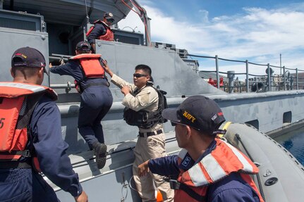 170623-N-PD309-168 BOHOL SEA (June 23, 2017) Engineman 2nd Class Reynaldo Saura, assigned to littoral combat ship USS Coronado (LCS 4), works with members of the Philippine Navy during a visit, board, search and seizure exercise for Maritime Training Activity (MTA) Sama Sama 2017. MTA Sama Sama is a bilateral maritime exercise between U.S. and Philippine naval forces and is designed to strengthen cooperation and interoperability between the nations' armed forces.   (U.S. Navy photo by Mass Communication Specialist 3rd Class Deven Leigh Ellis/Released)