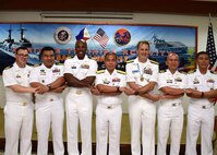 170624-N-QV906-164 CEBU, Philippines (June 24, 2016) Officers from the U.S. Navy and Armed Forces of the Philippines stand hand-in-hand during the closing ceremony of Maritime Training Activity (MTA) Sama Sama 2017 in Cebu, Philippines, June 24. (U.S. Navy photo by Mass Communication Specialist 1st Class Micah Blechner/RELEASED)