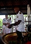 170529-N-QV906-195 SATTAHIP NAVAL BASE, Thailand (May 29, 2017) - Deputy Commander, Destroyer Squadron 7, Capt. Alexis Walker lights incence at a Buddist Temple on Sattahip Naval Base after the openinc ceremony for Cooperation Afloat Readiness and Training Thailand 2017 May 29.  Cooperation Afloat Readiness and Training (CARAT) is a series of PACOM sponsored, U.S. Pacific Fleet led bilateral exercises held annually in South and Southeast Asia to strengthen relationships and enhance force readiness. CARAT exercise events cover a broad range of naval skill areas and disciplines including surface, undersea, air and amphibious warfare; maritime security operations; riverine, jungle and explosive ordnance disposal operations; combat construction; diving and salvage; search and rescue; maritime patrol and reconnaissance aviation; maritime domain awareness; military law, public affairs and military medicine; and humanitarian assistance, disaster response. (U.S. Navy photo by Mass Communication Specialist 1st Class Micah Blechner/RELEASED)