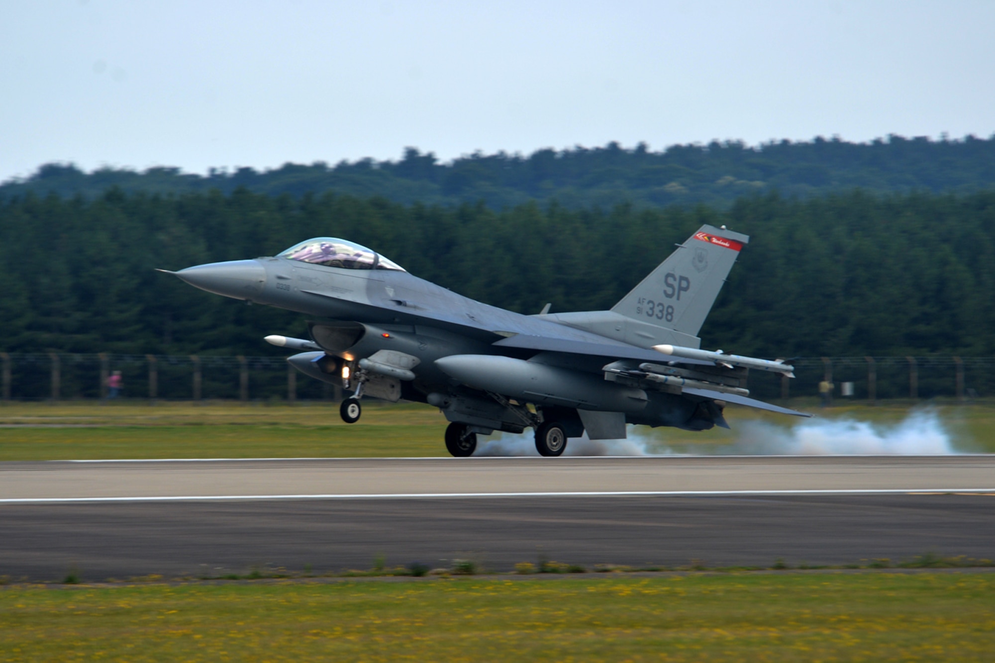 An F-16 Fighting Falcon assigned to the 52nd Fighter Wing at Spangdahlem Air Base, Germany, lands at Royal Air Force Lakenheath, England, July 10. Airmen from the 52nd FW will train alongside 48th Fighter Wing Airmen and British Allies during a flying training deployment here, which is scheduled to last several weeks. (U.S. Air Force photo/Master Sgt. Eric Burks)