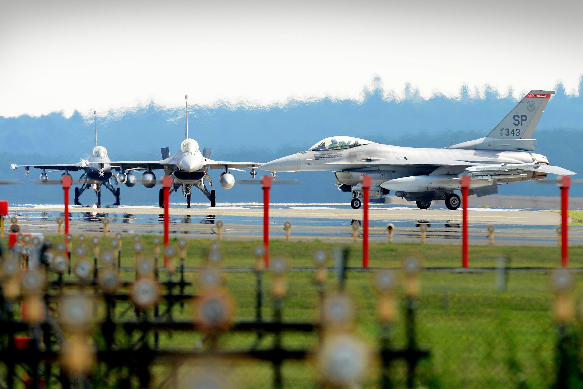 F-16 Fighting Falcon aircraft from the 480th Fighter Squadron, Spangdahlem Air Base, Germany, arrive at Royal Air Force Lakenheath, England, July 10. Airmen from the 52nd FW will train alongside 48th Fighter Wing Airmen and British Allies during a flying training deployment here, which is scheduled to last several weeks. (U.S. Air Force photo/Tech. Sgt. Matthew Plew)