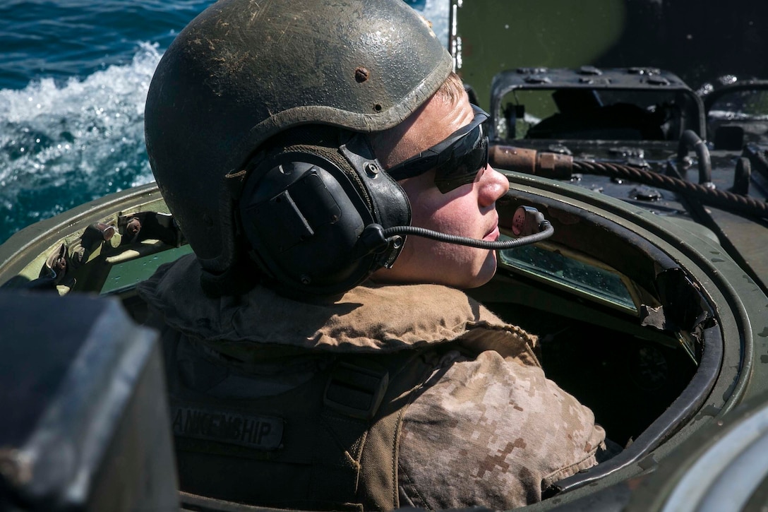 Lance Cpl. Mason Blankenship, an assault amphibious vehicle driver with India Company, Battalion Landing Team, 3rd Battalion, 5th Marines, 31st Marine Expeditionary Unit, heads toward land aboard an Assault Amphibious Vehicle during rehearsals for Exercise Talisman Saber 17, near Australian Defence Force’s Cowley Beach Training Area, Queensland, Australia, July 8, 2017. India Company is the mechanized raid company for the 31st MEU, currently supporting Talisman Saber 17 while deployed on its regularly-scheduled patrol of the Indo-Asia-Pacific region. Talisman Saber is a biennial exercise designed to improve the interoperability between Australian and U.S. forces. 