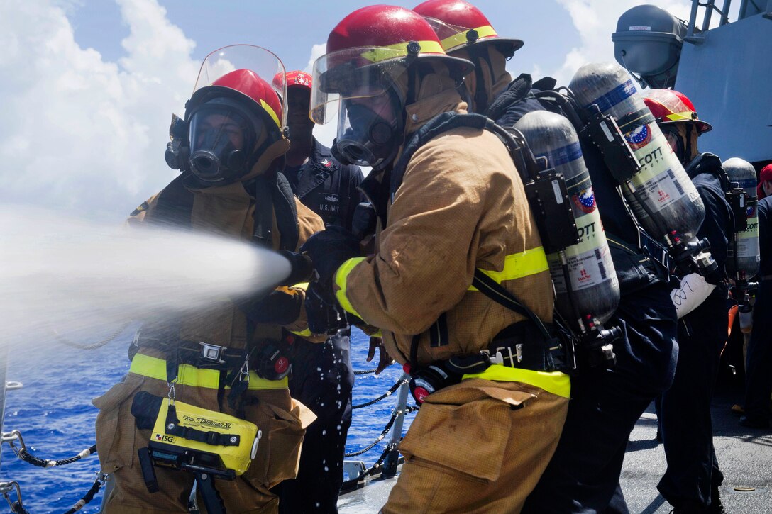 Sailors participate in firefighting training during a general quarters training evolution aboard the Arleigh Burke-class guided-missile destroyer USS Pinckney in the Pacific Ocean, July 2, 2017. Navy photo by Petty Officer 2nd Class Craig Z. Rodarte