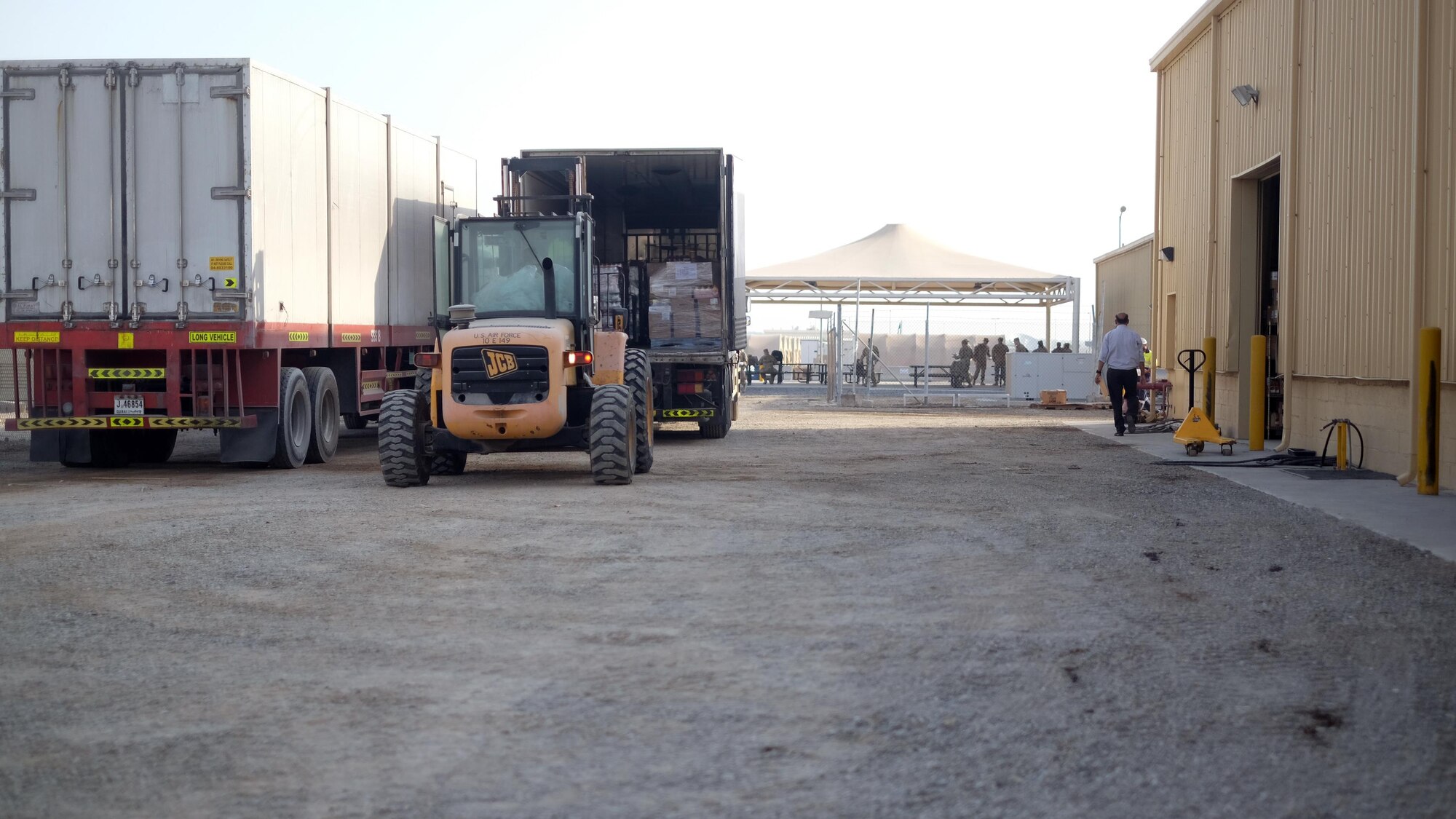 Staff Sgt. Roberto, 380th Force Support Squadron storeroom manager, unloads pallets of food July 6, 2017, at an undisclosed location in southwest Asia. Each week, 380 EFSS receives three shipments of food and two shipments of water. Each food order contains as much as $80,000 worth of food and water orders cost up to $13,000. (U.S. Air Force photo by Senior Airman Preston Webb)