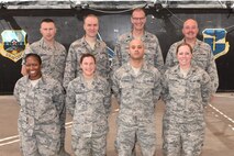 Members of the 380th Air Expeditionary Wing CARE Team pose for a photo at an undisclosed location in southwest Asia, June 28, 2017. The CARE Team is comprised of the chapel, equal opportunity, sexual assault response coordinator and mental health. These four agencies work together where their duties may overlap to ensure that deployed Airmen receive the care they need to support their mental and spiritual wellness. (U.S. Air Force photo by Staff Sgt. Marjorie A. Bowlden)