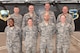 Members of the 380th Air Expeditionary Wing CARE Team pose for a photo at an undisclosed location in southwest Asia, June 28, 2017. The CARE Team is comprised of the chapel, equal opportunity, sexual assault response coordinator and mental health. These four agencies work together where their duties may overlap to ensure that deployed Airmen receive the care they need to support their mental and spiritual wellness. (U.S. Air Force photo by Staff Sgt. Marjorie A. Bowlden)