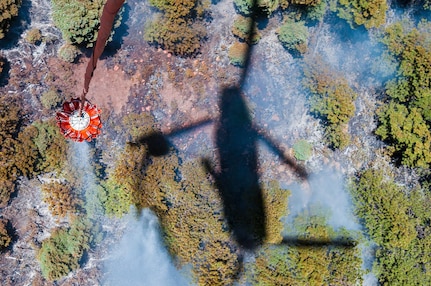 Helicopter bucket operations performed June 21, 2013, by a CH-47 Chinook crew from the Colorado Army National Guard's 2nd Battalion of the 135th Aviation Regiment, stationed at Buckley Air Force Base, Aurora, Colo. Guard members in Arizona, California, Colorado and Wyoming are assisting in fire operations.

