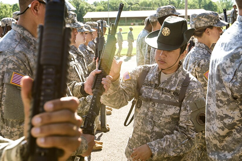 U.S. Army Reserve Staff Sgt. Jennifer Samargo, a drill sergeant with the 104th Training Division based at Joint Base Fort Lewis McChord in Washington State and assigned to Task Force Wolf, corrects the position of a Reserve Officers’ Training Corps cadet attending Cadet Summer Training (CST) at Fort Knox, Kentucky, June 7, 2017. Every drill sergeant assigned to Task Force Wolf is an Army Reserve Soldier.  (U.S. Army photo by Army Staff Sgt. Scott Griffin, U.S. Army Reserve Command-Public Affairs Office) (RELEASED)