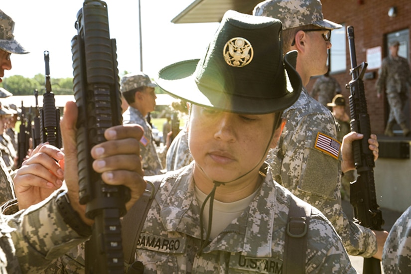 U.S. Army Reserve Staff Sgt. Jennifer Samargo, a drill sergeant with the 104th Training Division, corrects the posture of a Reserve Officer Training Corps cadet attending Cadet Summer Training at Fort Knox, Kentucky, June 7, 2017. Every drill sergeant serving at CST is an Army Reserve Soldier.(U.S. Army photo by Army Staff Sgt. Scott Griffin, U.S. Army Reserve Command-Public Affairs Office) (RELEASED)