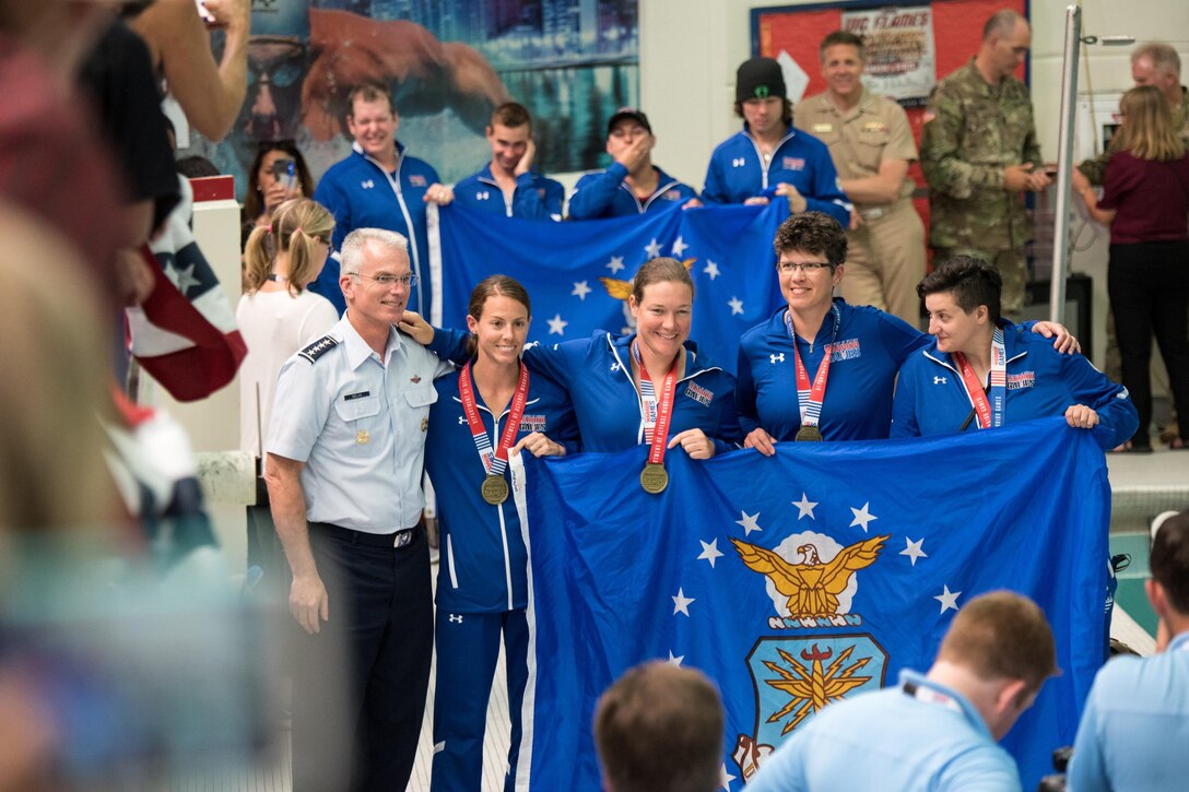 Air Force Gen. Paul J. Selva, vice chairman of the Joint Chiefs of Staff, poses with the Team Air Force 200m Women's Freestyle swim competition Gold Medal winners during the 2017 Department of Defense Warrior Games in Chicago, July 8, 2017. DoD photo by Army Sgt. James K. McCann