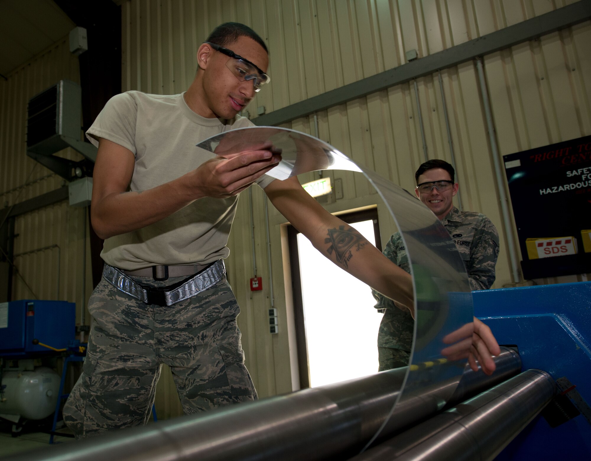 U.S. Air Force Airman 1st Class Aarien Foster, 86th Maintenance Squadron aircraft structural maintenance apprentice, uses a slip roller to arc a piece of metal on Ramstein Air Base, Germany, July 5, 2017.  The aircraft structural maintenance shop uses machines like the slip roller to give aircraft parts, such as hull and wing pieces, the precise curvature to replace damaged parts. (U.S. Air Force photo by Senior Airman Elizabeth Baker)