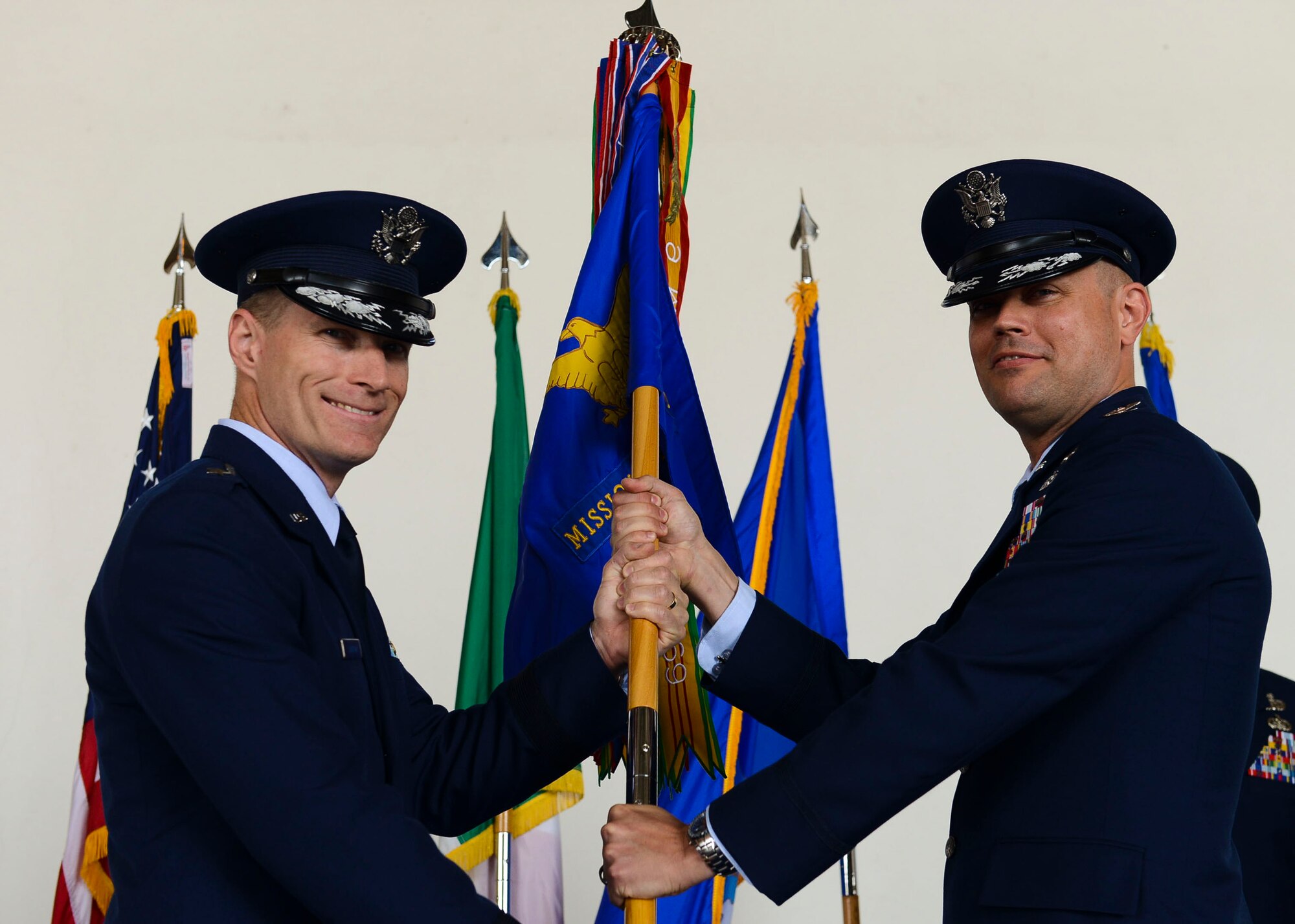 Col. Jeffrey York takes command of the 31st Mission Support Group from Col. Jenise Carroll during a change of command ceremony, July 7, 2017, at Aviano Air Base, Italy. Brig. Gen. Lance Landrum, 31st Fighter Wing commander, presided over the event. (U.S. Air Force photo by Staff Sgt. Austin Harvill)