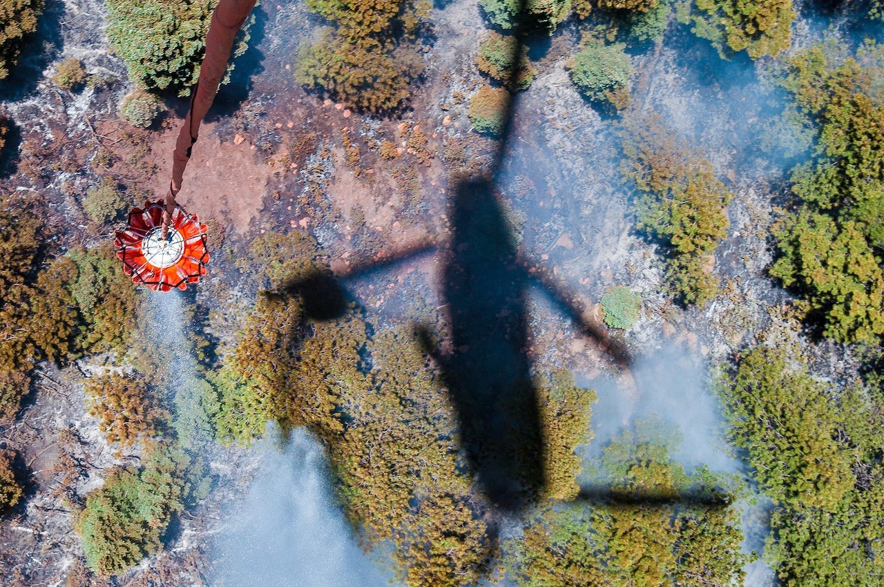 Helicopter bucket operations performed June 21, 2013, by a CH-47 Chinook crew from the Colorado Army National Guard's 2nd Battalion of the 135th Aviation Regiment, stationed at Buckley Air Force Base, Aurora, Colo. Guard members in Arizona, California, Colorado and Wyoming are assisting in fire operations.

