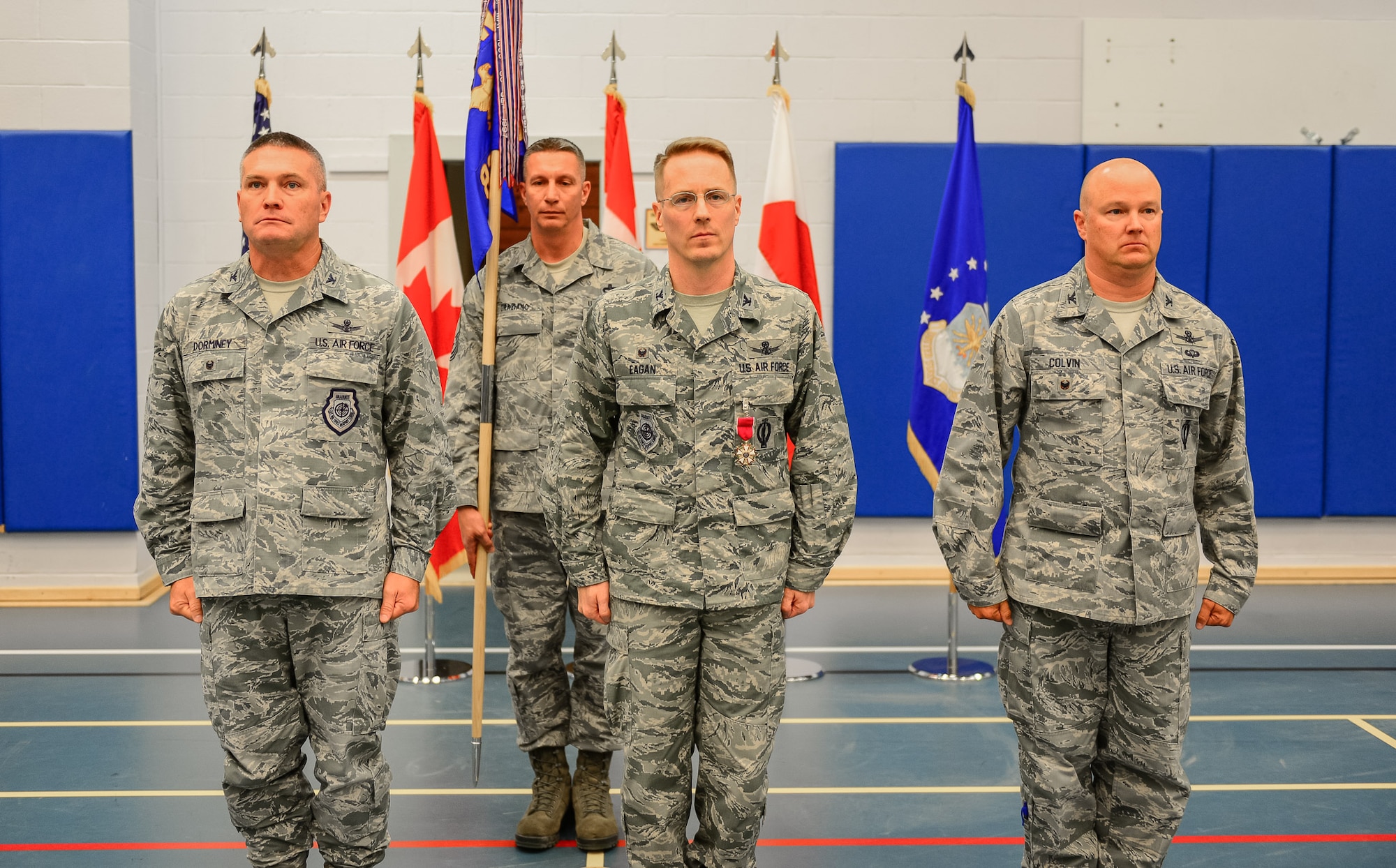 THULE AIR BASE, Greenland – Col. Eric Dorminey (left), 21st Space Wing vice commander, presides over the 821st Air Base Group change of command ceremony for the outgoing commander, Col. Christopher Eagan (middle), and the incoming commander, Col. Thomas Colvin (right), June 29, 2017, at Thule Air Base, Greenland. Thule Air Base is located on the northwest coast of Greenland, 700 miles north of the Arctic Circle and approximately 946 miles from the North Pole. (U.S. Air Force photo by Capt. Md Hussain)