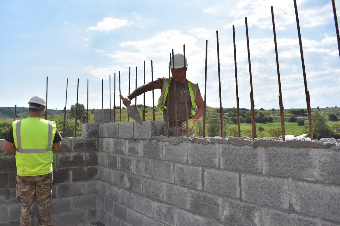 Sapper Kieran Trafford of the U.K. Royal Monmouthshire Royal Engineers spreads mortar for a Light Demolition Range as part of Operation Resolute Castle 2017 at the Joint National Training Center, Cincu, Romania. Resolute Castle is an exercise strengthening the NATO alliance and enhancing its capacity for joint training and response to threats within the region.