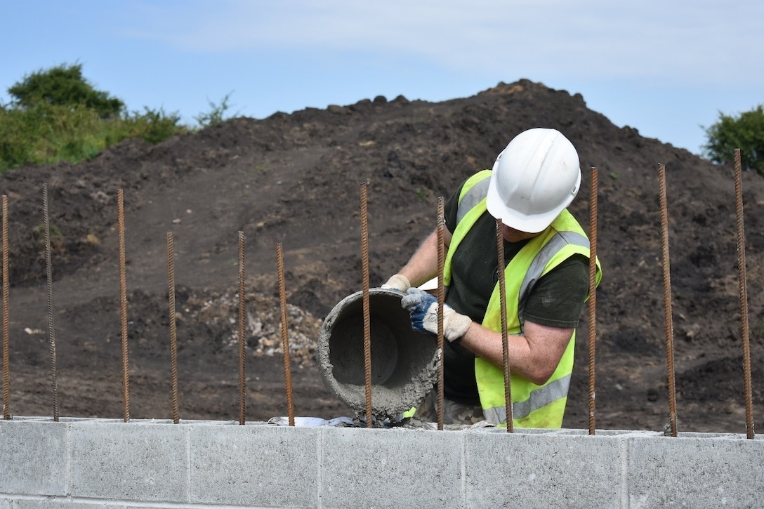 Sapper Anthony Heath, U.K. Royal Monmouthshire Royal Engineers, pours grout for a Light Demolition Range as part of Operation Resolute Castle 2017 at the Joint National Training Center, Cincu, Romania. Resolute Castle is an exercise strengthening the NATO alliance and enhancing its capacity for joint training and response to threats within the region.