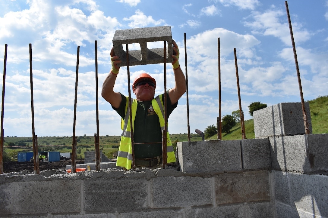 Lance Cpl. Pete Lugg of the U.K. Royal Monmouthshire Royal Engineers, lays block for a Light Demolition Range as part of Operation Resolute Castle at the Joint National Training Center, Cincu, Romania. Resolute Castle 2017 is an exercise strengthening the NATO alliance and enhancing its capacity for joint training and response to threats within the region.