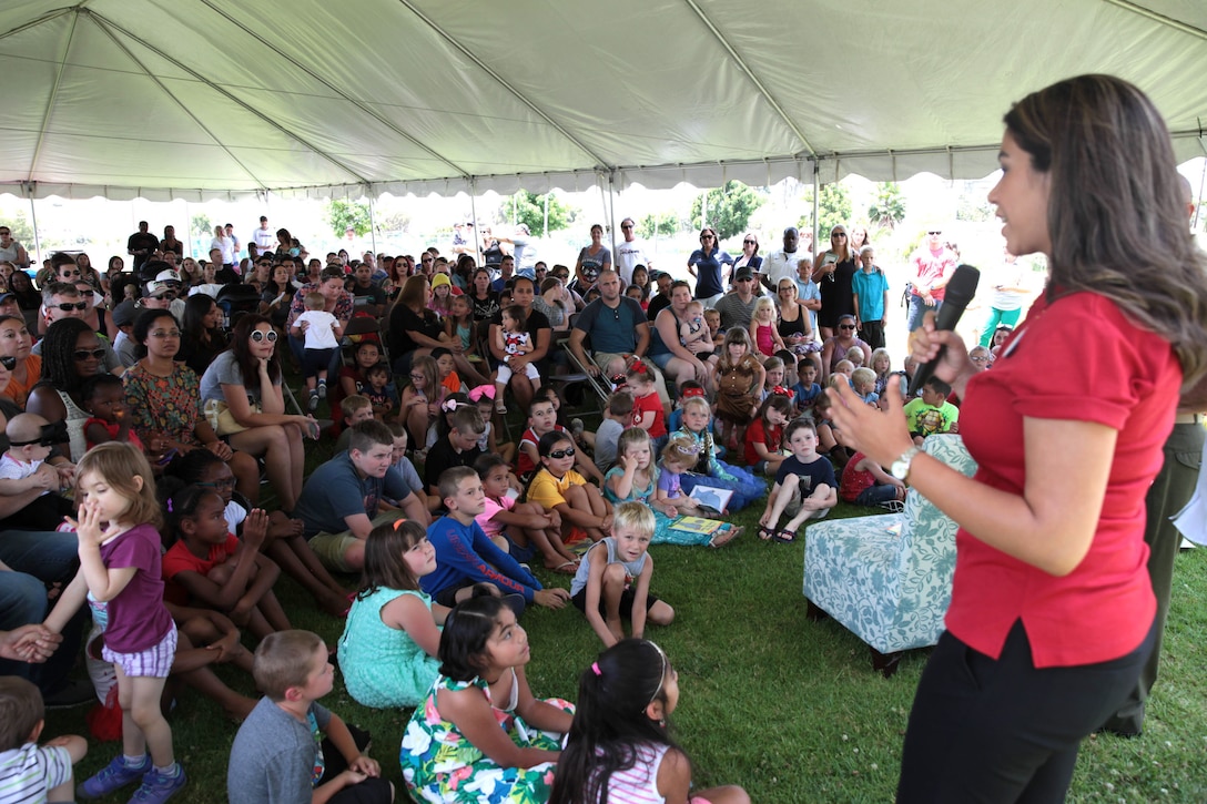 Alexa Garcia, an Ambassador with The Walt Disney Company, addresses the crowd prior to a book reading, Camp Pendleton, Calif., July 8th, 2017. Books on Bases brings books to military children and is a part of Blue Star Families' and The Walt Disney Company's  ongoing effort to to support military families across the nation. (U.S. Marine Corps Photo by LCpl. Dylan Chagnon)