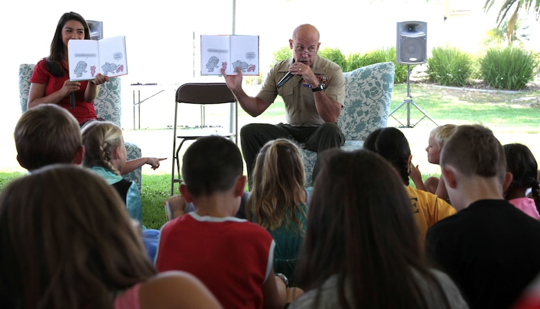 Col. Gary S. Johnston, Chief of Staff, Marine Corps Installations - West, reads aloud "The Big Guy Took My Ball" to children and their families during Books on Bases, Camp Pendleton, Calif., July 8th, 2017. Books on Bases brings books to military children and is a part of Blue Star Families' and The Walt Disney Company's  ongoing effort to to support military families across the nation. (U.S. Marine Corps Photo by LCpl. Dylan Chagnon)