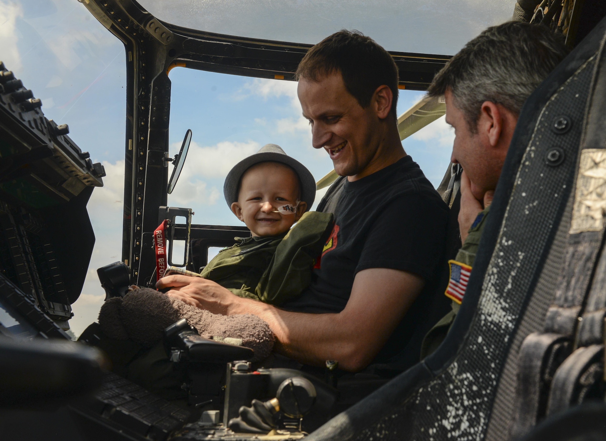 Jay Davidson and his father, Martin, sit in a U.S. Air Force CV-22 Osprey during a Pilot for a Day visit July 7, 2017, on RAF Mildenhall, England. During the visit, Jay and his parents also viewed a KC-135 Stratotanker and an MC-130J Commando II, in addition to a tour of the air traffic control tower. (U.S. Air Force photo by Staff Sgt. Micaiah Anthony)