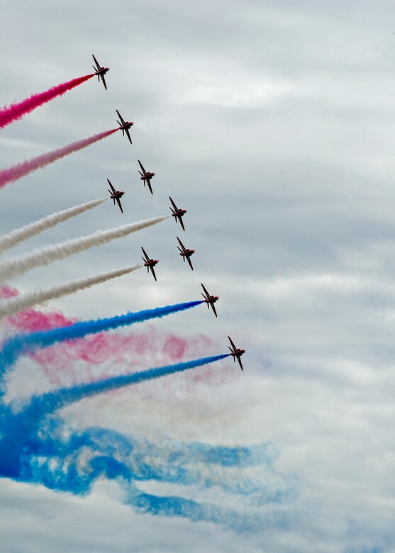 The Royal Air Force Red Arrows wowed the crowd with a series of impressive aerial acrobatics at Royal Naval Air Station, U.K. who also have cool rides, and took this photo with them. Citizen Airmen from the 701st Airlift Squadron set the bar high by flying the first C-17 low-level pass through the “Mach Loop” and captured another win for their static display at the the air show Friday and Saturday. (U.S. Air Force Photo \ Tech. Sgt. Bobby Pilch)