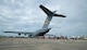 Hundreds of spectators line up to see the inside of a Joint Base Charleston C-17 Globemaster III at the Yeovilton International Air Day at Royal Naval Air Station, U.K. Citizen Airmen from the 701st Airlift Squadron set the bar high by flying the first C-17 low-level pass through the “Mach Loop” and captured another win for their static display at the the air show Friday and Saturday. (U.S. Air Force Photo \ Tech. Sgt. Bobby Pilch)