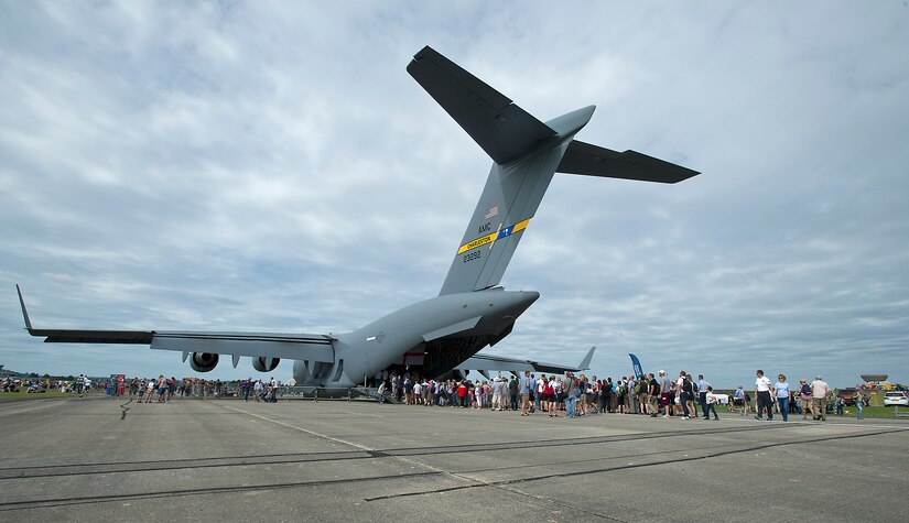 Hundreds of spectators line up to see the inside of a Joint Base Charleston C-17 Globemaster III at the Yeovilton International Air Day at Royal Naval Air Station, U.K. Citizen Airmen from the 701st Airlift Squadron set the bar high by flying the first C-17 low-level pass through the “Mach Loop” and captured another win for their static display at the the air show Friday and Saturday. (U.S. Air Force Photo \ Tech. Sgt. Bobby Pilch)