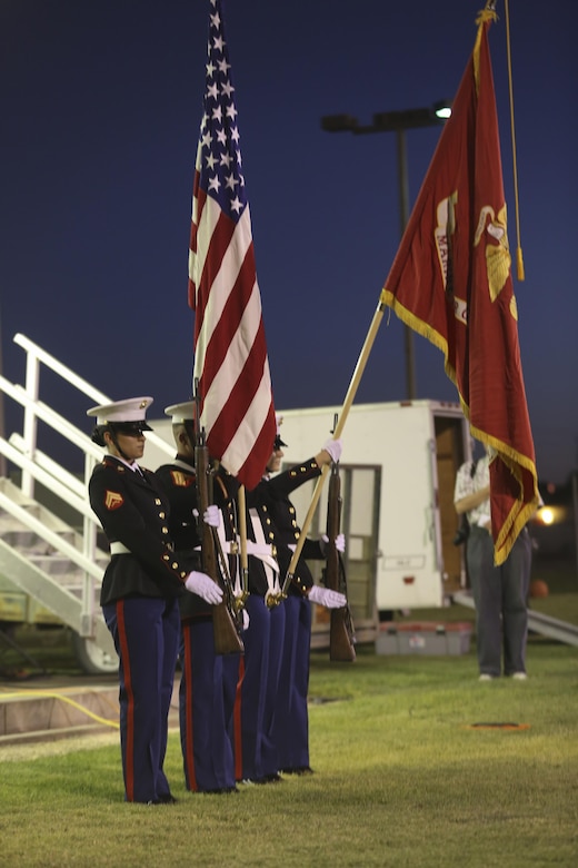 The Marine Corps Air Ground Combat Center Headquarters Battalion Color Guard presents the colors for the National Anthem during the Twentynine Palms Independence Day celebration in Luckie Park, Twentynine Palms, Calif., July 4, 2017. Following the presentation of the national and Marine Corps colors, the City of Twentynine Palms organized a firework demonstration to celebrate Independence Day. (U.S. Marine Corps photo by Lance Cpl. Christian Lopez)