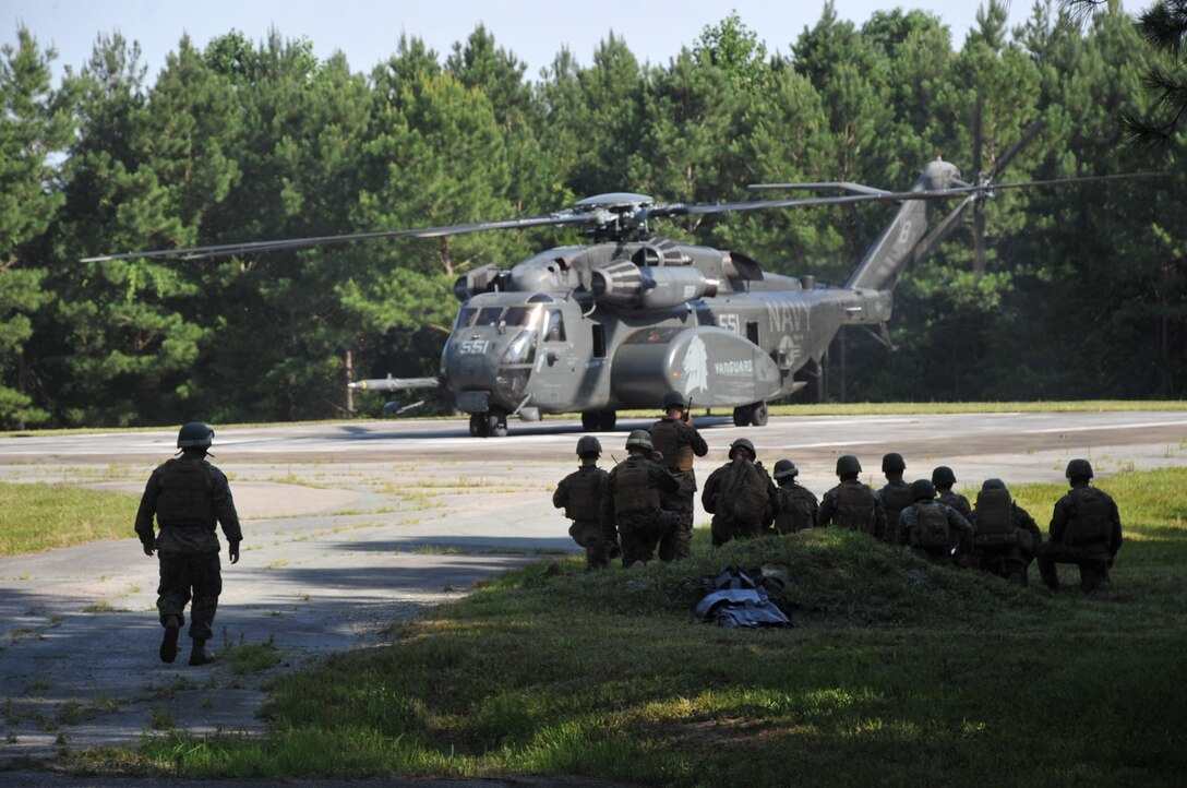 Marines from Marine Corps Security Force Regiment conduct casualty evacuation drills aboard Naval Weapons Station Yorktown, Va., on June 29. These drills were conducted in order to prepare the unit for future deployments and potential real-world situations they may encounter while deployed.  (Official U.S. Navy photo)