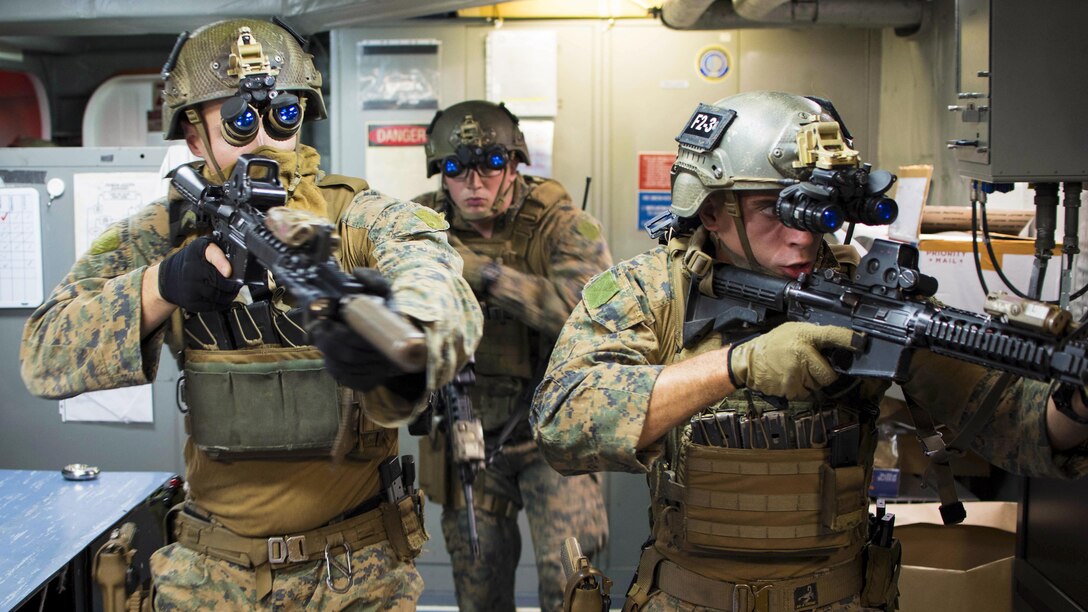 Marines practice room clearing techniques during visit, board, search and seizure training aboard the USS Bonhomme Richard in the Coral Sea, July 6, 2017, during Talisman Saber 17. Talisman Saber is a biennial U.S.-Australia exercise designed to enhance interoperability and strengthen the nations’ alliance. Navy photo by Petty Officer 3rd Class William Sykes