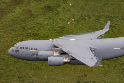 Citizen Airmen from the 701st Airlift Squadron made history by flying the first C-17 Globemaster III low-level pass through the “Mach Loop” in Wales, U.K. (Courtesy Photo by Paul Williams)