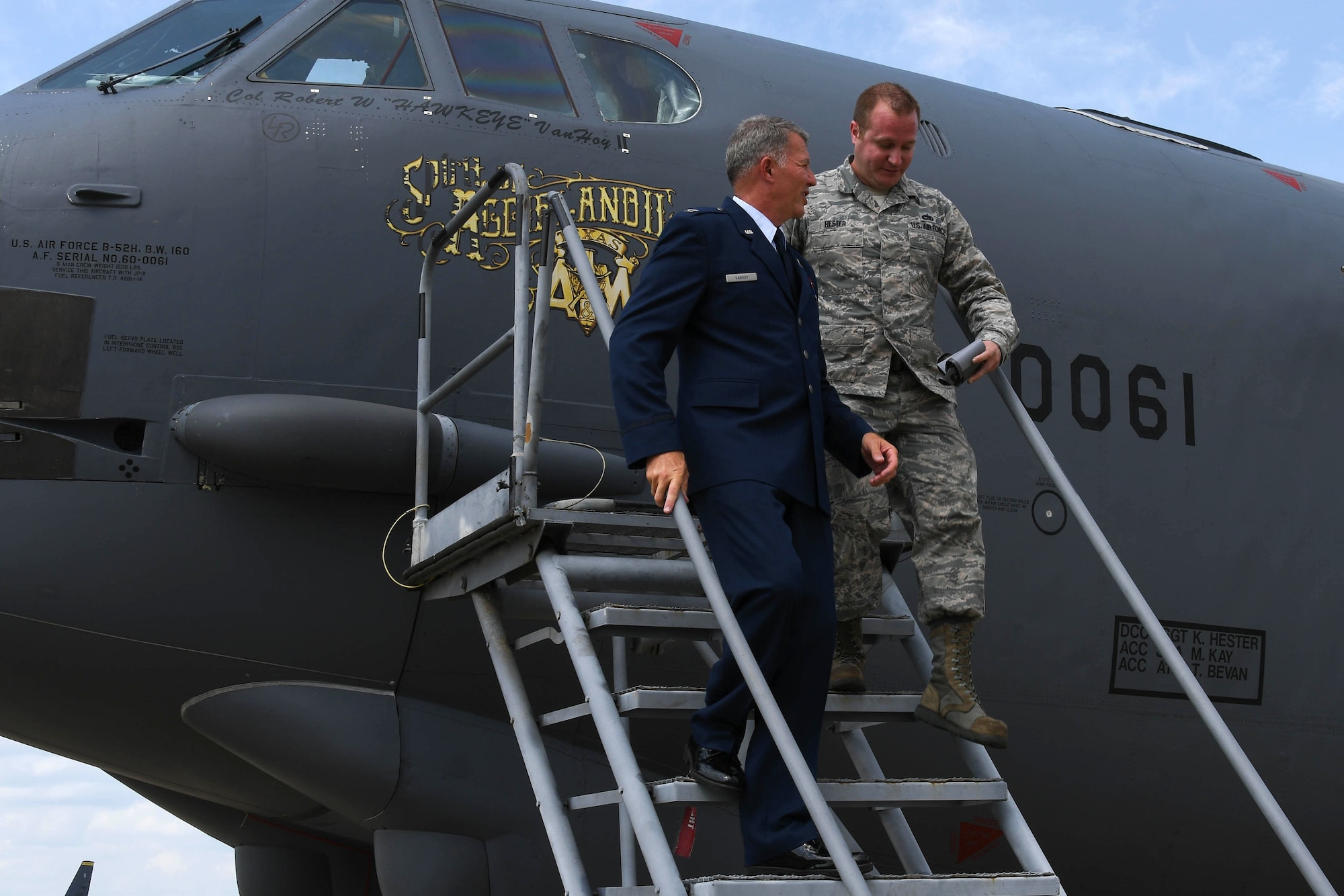 U.S. Air Force Tech. Sgt. Keith Hester, a 307th Bomb Wing crew chief, joins Col. Robert VanHoy II for the unveiling of his name on B-52 Stratofortress 60-061 following the 307th Bomb Wing change of command ceremony July 8, 2017 at Barksdale Air Force Base, La. VanHoy assumed command of the 307th and is the former commander of the 93rd Bomb Squadron. (U.S. Air Force photo by Staff Sgt. Callie Ware/Released)