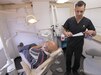 Maj. Jose Cangas, an Army Reserve dentist with the 7458th Medical Backfill Battalion, prepares to assist a patient during an Innovative Readiness Training mission in Laredo, Texas, June 21, 2017. Born and raised in El Paso, a similar border city located in west Texas, the 37-year-old Soldier traveled to Laredo to treat hundreds of people living in low-income border communities as part of the two-week mission, which concluded Saturday. (Photo Credit: Sean Kimmons)