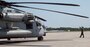 A Marine gives signals to the pilots of a CH-53 Super Stallion before taking off for a ceremony at Marine Corps Air Station New River, N.C., May 17, 2017.  The ceremony marks the reopening of Landing Zone Vulture, which closed Sept. 2, 2015 after a CH-53 crashed resulting in the death of one Marine.  The instructors took the opportunity to memorialize their fallen Marine, Staff Sgt. Jonathan Lewis, through the sustainment rappel. The Marines are with EOTG, II Marine Expeditionary Force Headquarters Group.